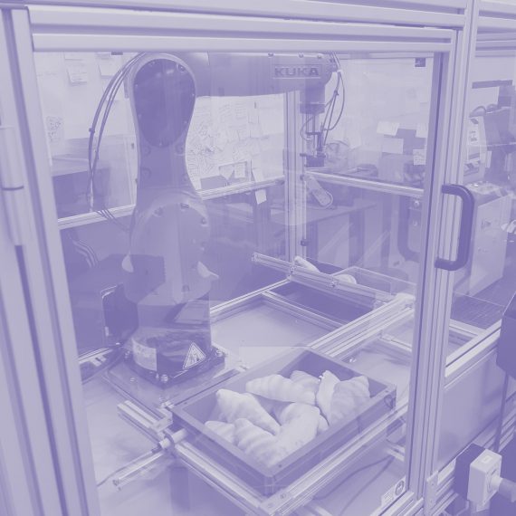 Bin Picking of Highly Variable Complex Shaped Parts feature image of robot picking croissants