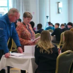 Students presenting to Judges Liz and Gary at Ideas Made Real Transition Year Programme Showcase and Awards Ceremony